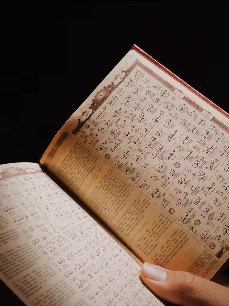 Open Quran resting on a stand